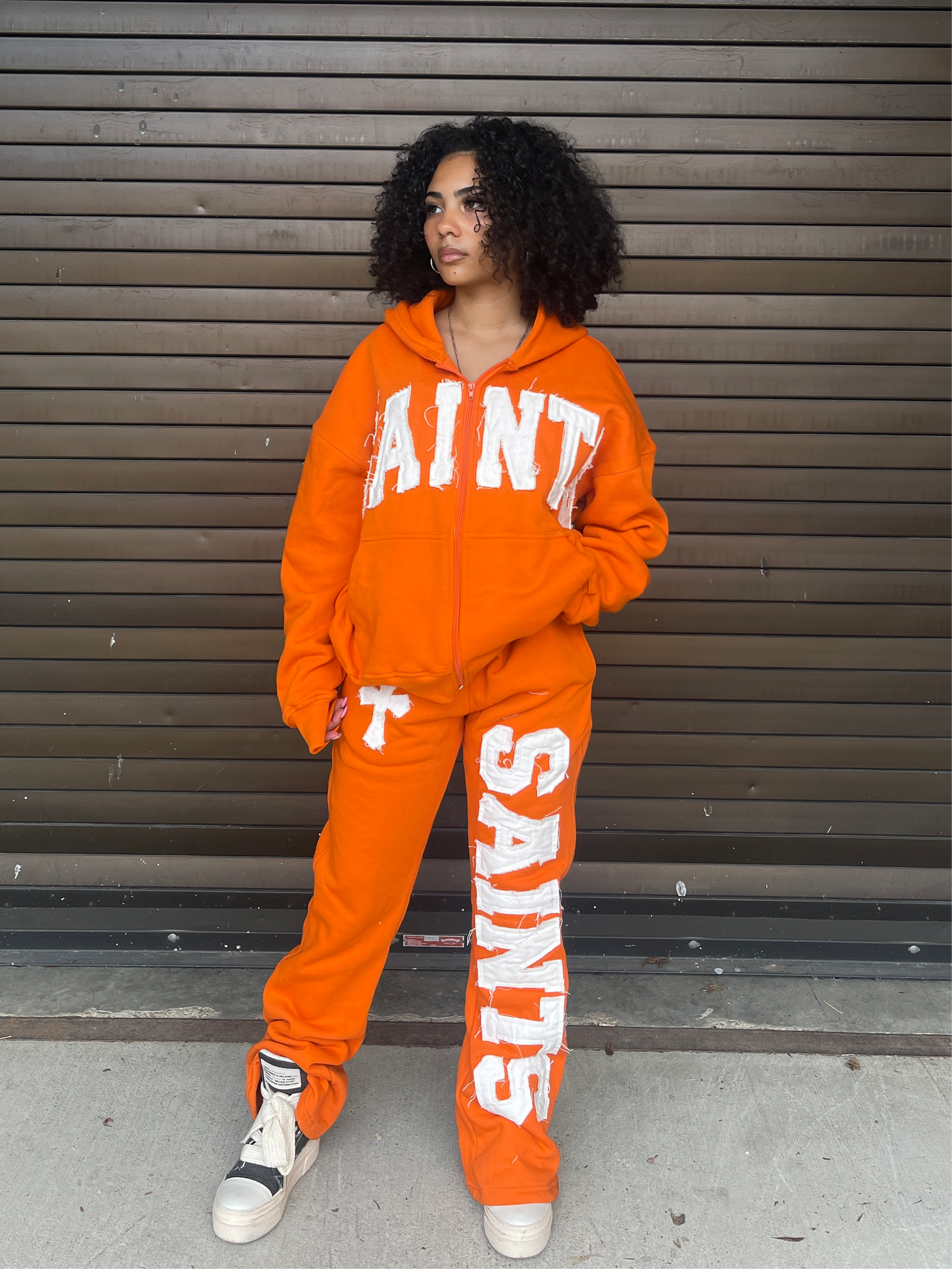 ORANGE "SAINTS" FLARED SWEATS